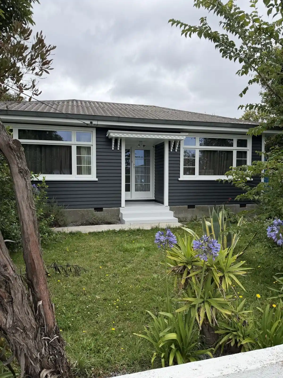 1940s bungalow on Nairn Street, Spreydon, repainted in charcoal with white trims