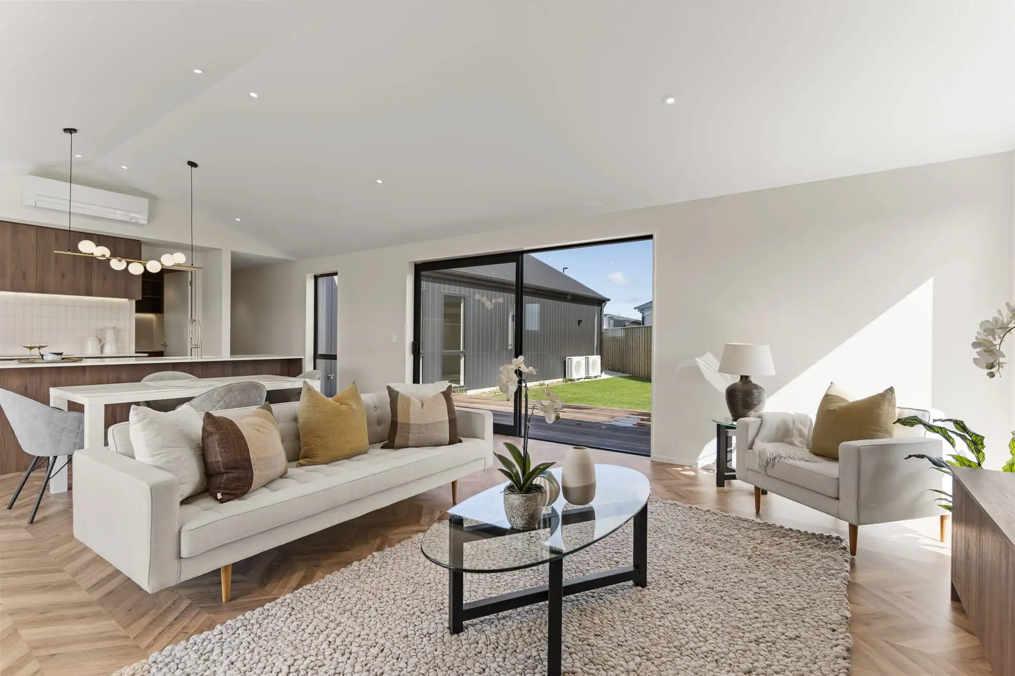 Living room looking through to the kitchen and sliding doors