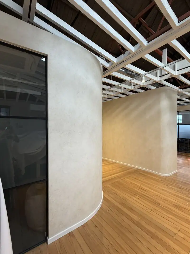 Curved wall in a Venetian plaster finish inside a commercial office fit-out